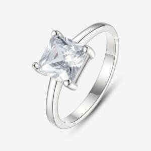 Silver engagement ring with a square-cut, clear gemstone set in a prong setting, displayed on a plain white background.