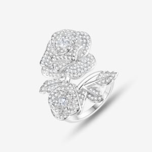 A silver ring with two intricately designed rose shapes, encrusted with small sparkling diamonds, and leaf details on a white background.
