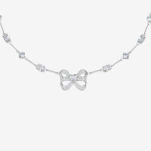 A delicate silver necklace featuring a bow-shaped centerpiece adorned with small sparkling stones. The chain is accented with evenly spaced clusters of glittering gems, set against a plain white background.