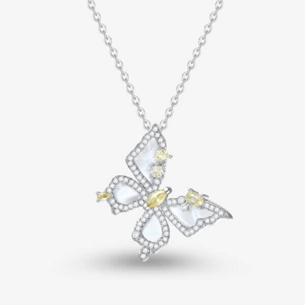 A silver necklace with a butterfly-shaped pendant, adorned with clear and yellow gemstones. The butterfly has intricately detailed wings and chain links are visible against a light background.