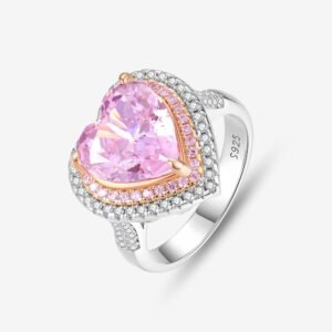 This Romantic Heart Halo Ring boasts a silver band engraved with S925, highlighting its sterling quality. At its center, a large heart-shaped pink gemstone is beautifully surrounded by small pink and clear stones, creating an enchanting look.