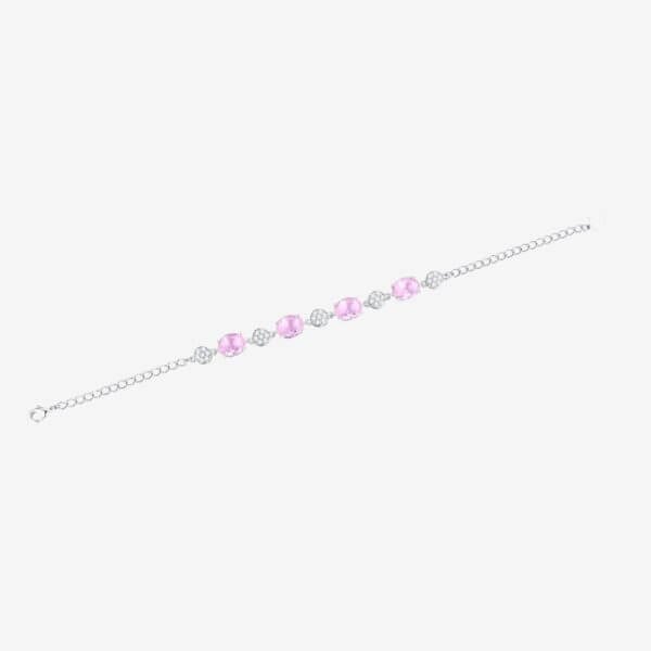 A silver bracelet with alternating pink gemstones and circular diamond-like accents, displayed on a white background.