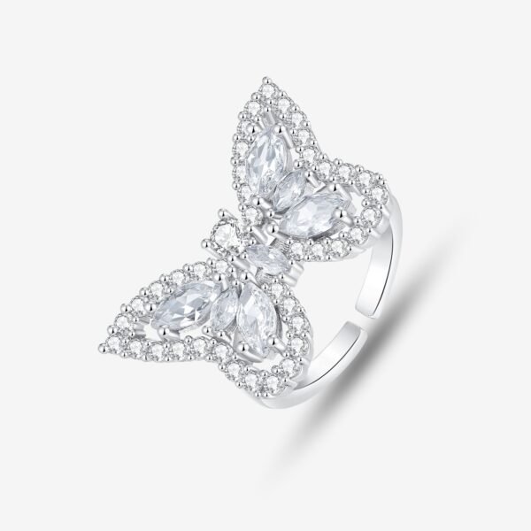 A silver butterfly-shaped ring adorned with multiple marquise-cut clear gemstones and surrounded by smaller round stones, displayed on a light gray background.