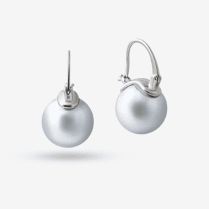 A pair of pearl drop earrings with silver hooks on a white background. Each earring features a round, lustrous white pearl, elegantly attached to a curved, polished silver setting.