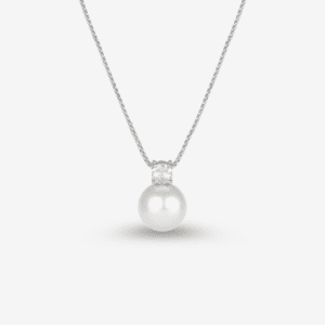 A silver necklace featuring a single, large white pearl pendant with a small diamond above it, displayed against a white background.